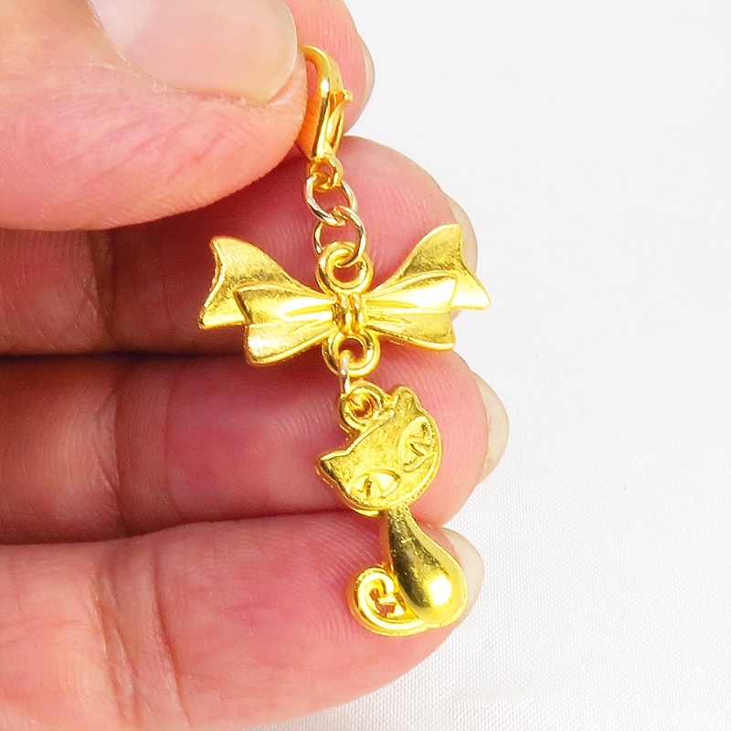 マスク・スマホチャーム ゴールドカラー 猫モチーフとリボンのコンパクトで可愛いチャーム ジャックピン追加可