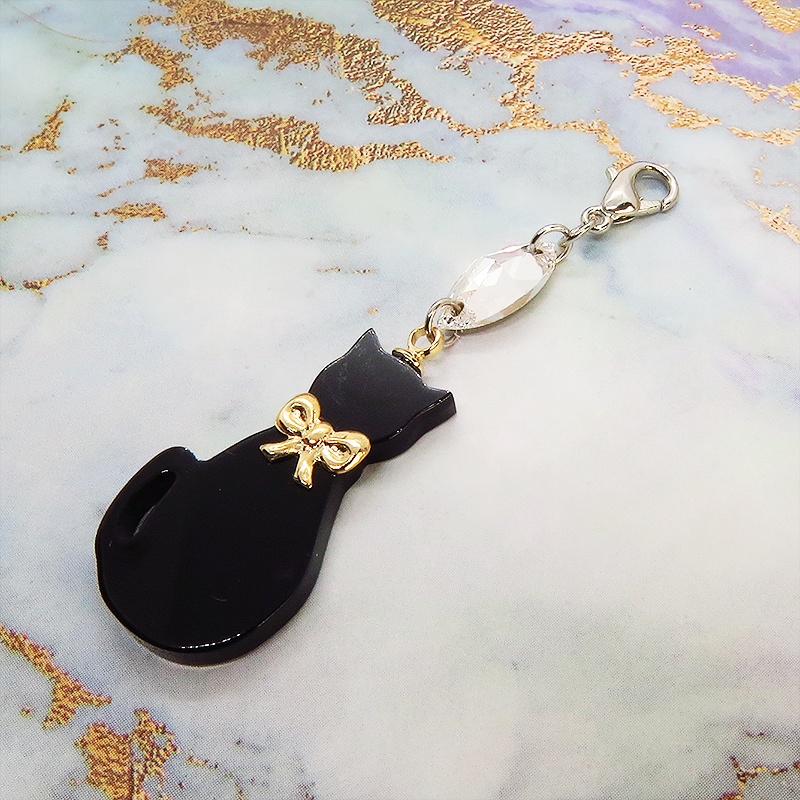 マスクチャーム ゴールドリボンの黒猫チャームとスワロフスキーのチャーム アクリル キーホルダー