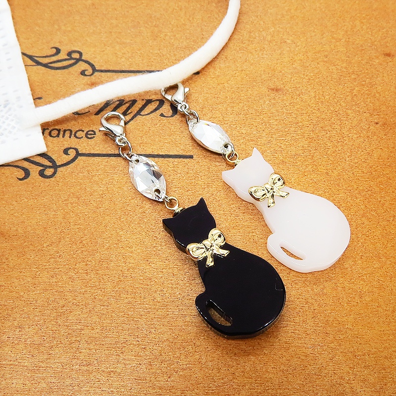 マスクチャーム ゴールドリボンの黒猫チャームとスワロフスキーのチャーム アクリル キーホルダー