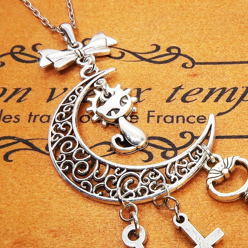 アンティークシルバー 猫とアラベスク調の透かし模様の入った三日月のネックレス リボン 鍵 ロザリオ 時計の針 長さ調整可