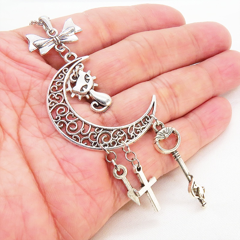 アンティークシルバー 猫とアラベスク調の透かし模様の入った三日月のネックレス リボン 鍵 ロザリオ 時計の針 長さ調整可