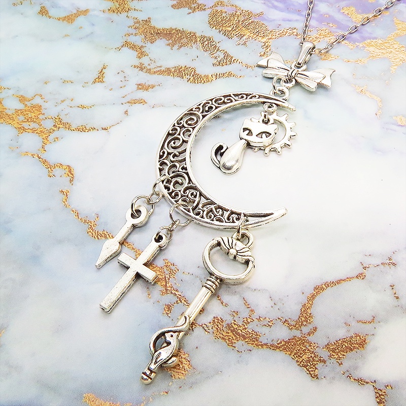 アンティークシルバー 猫とアラベスク調の透かし模様の入った三日月のネックレス リボン 鍵 ロザリオ 時計の針 長さ調整可