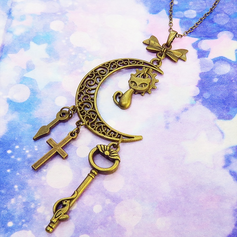 アンティークゴールド 猫とアラベスク調の透かし模様の入った三日月のネックレス リボン 鍵 ロザリオ 時計の針 長さ調整可