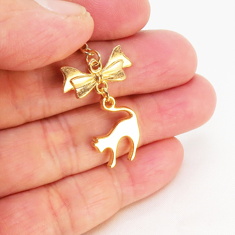 マスクチャーム マットゴールドの跳ね猫とリボンの大人可愛いチャーム キーホルダー