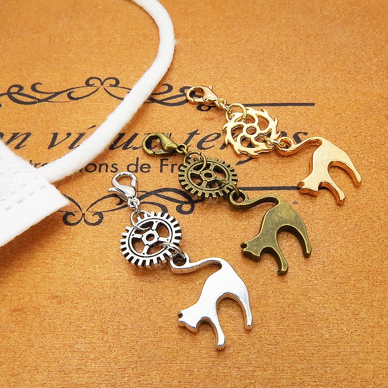 マスクチャーム チームパンク風 跳ね猫と歯車のシンプルなチャーム キーホルダー アンティークカラー