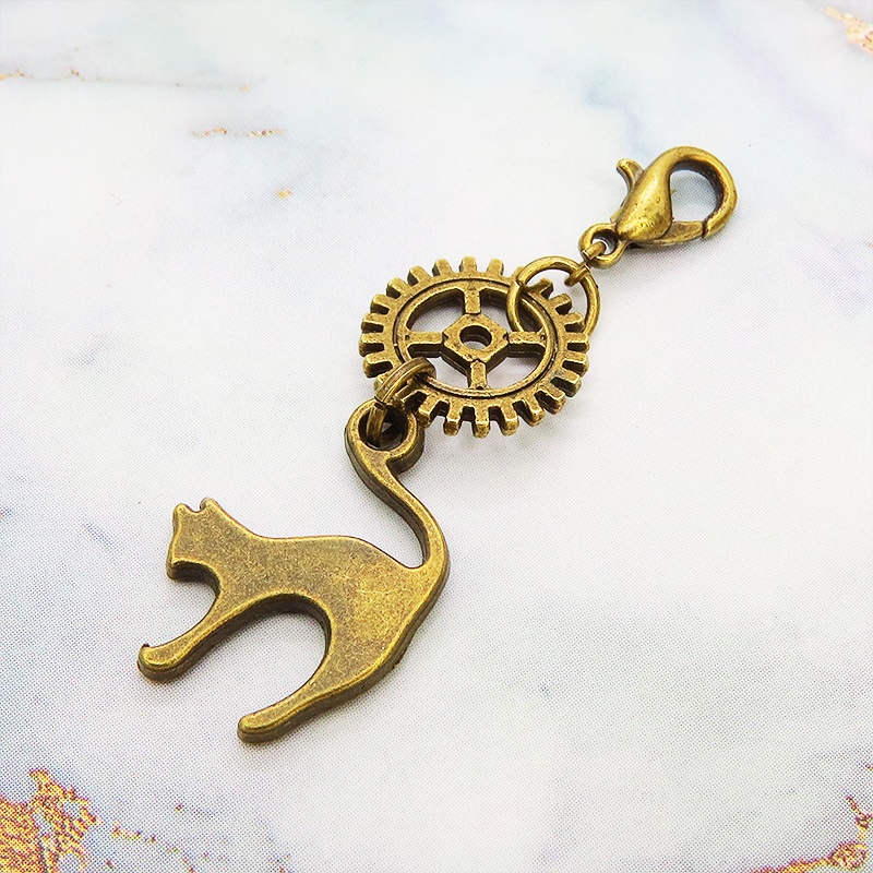 マスクチャーム チームパンク風 跳ね猫と歯車のシンプルなチャーム キーホルダー アンティークカラー