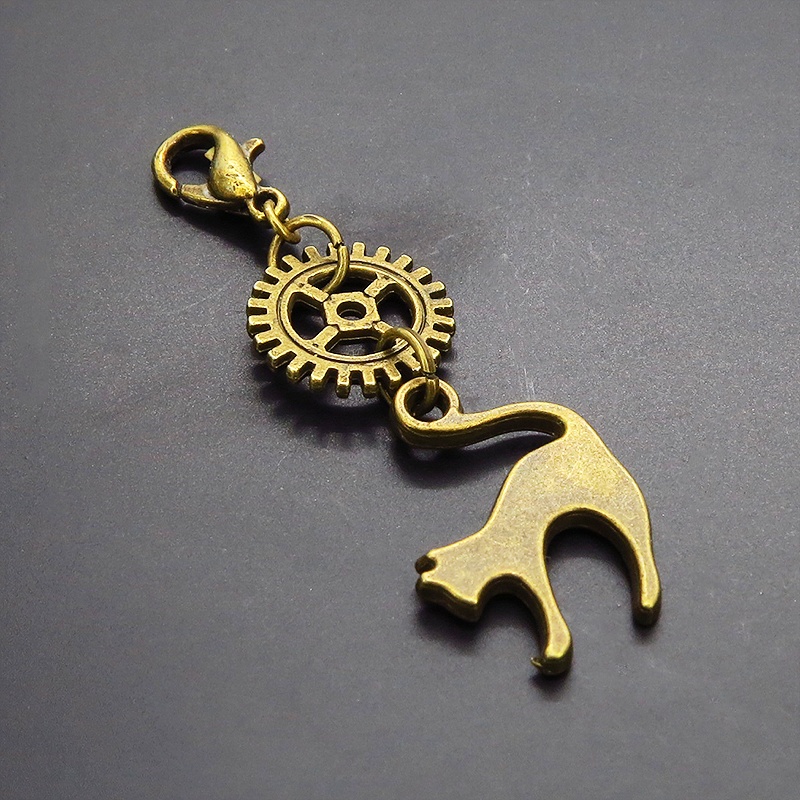 マスクチャーム チームパンク風 跳ね猫と歯車のシンプルなチャーム キーホルダー アンティークカラー