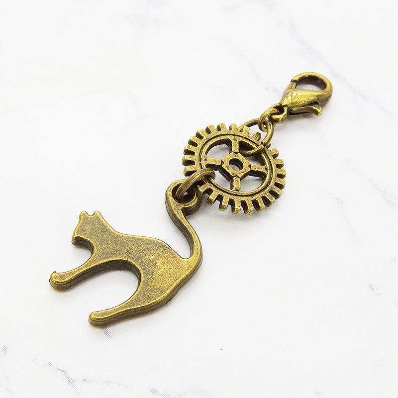 マスクチャーム チームパンク風 跳ね猫と歯車のシンプルなチャーム キーホルダー アンティークカラー