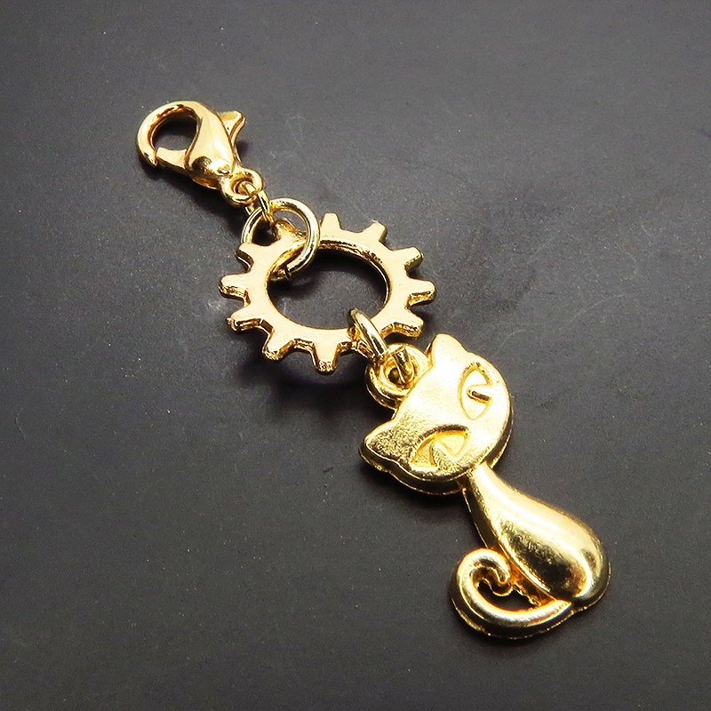 マスクチャーム マットゴールド 猫と中があいた歯車を組み合わせた可愛いチャーム キーホルダー スチームパンク風