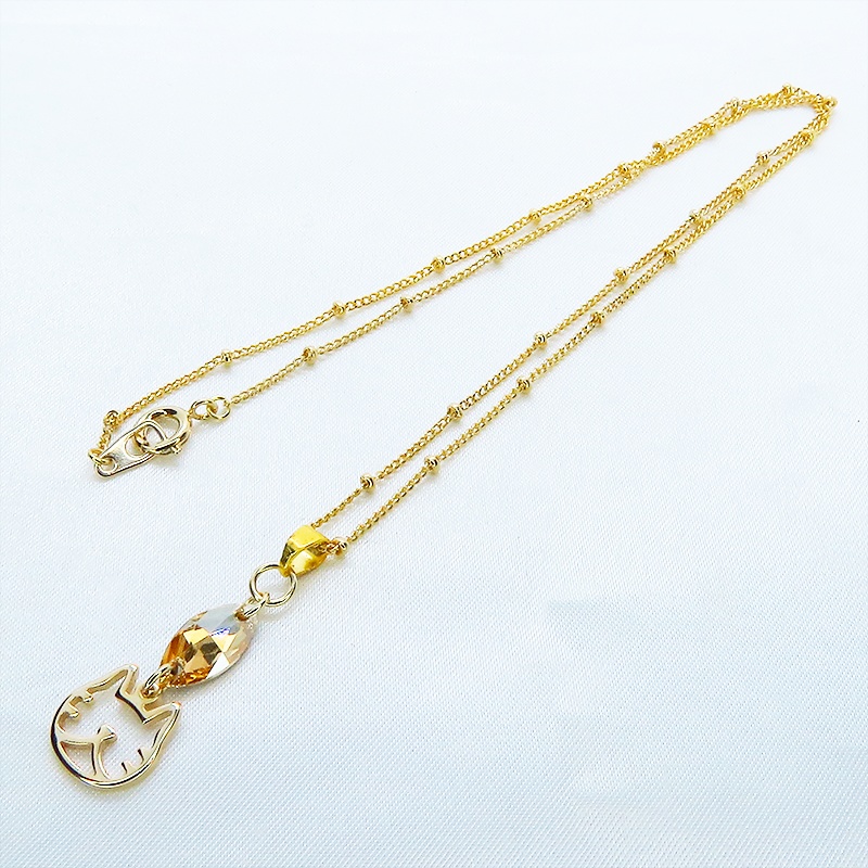 猫フェイスシルエットモチーフとと大きめスワロフスキー・クリスタル(クリアカラー)のネックレス ゴールドカラー