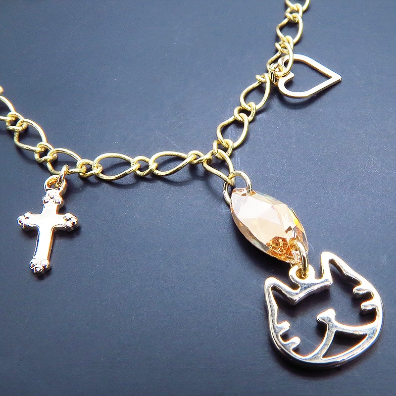 猫フェイスシルエットモチーフと大きめスワロフスキー(ゴールドシャドー)のブレスレット ゴールドカラー ロザリオ ハート