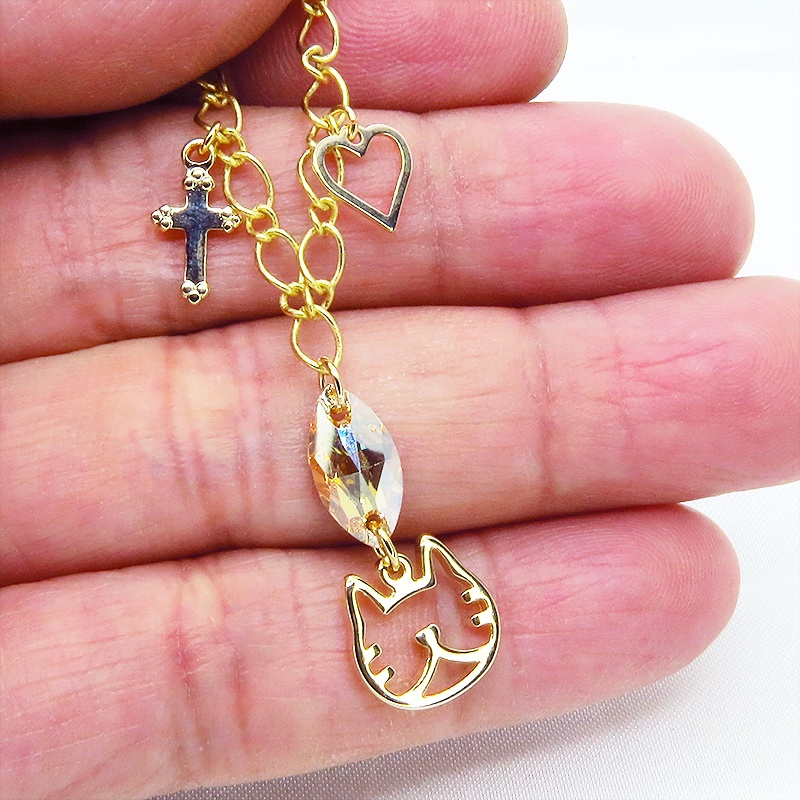 猫フェイスシルエットモチーフと大きめスワロフスキー(ゴールドシャドー)のブレスレット ゴールドカラー ロザリオ ハート