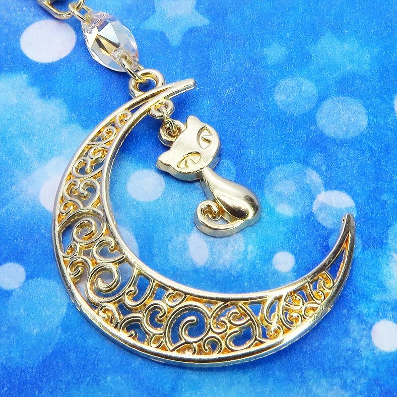 マットゴールドの猫モチーフと透かし三日月のキーホルダー スワロフスキー・クリスタル(ゴールドシャドー)