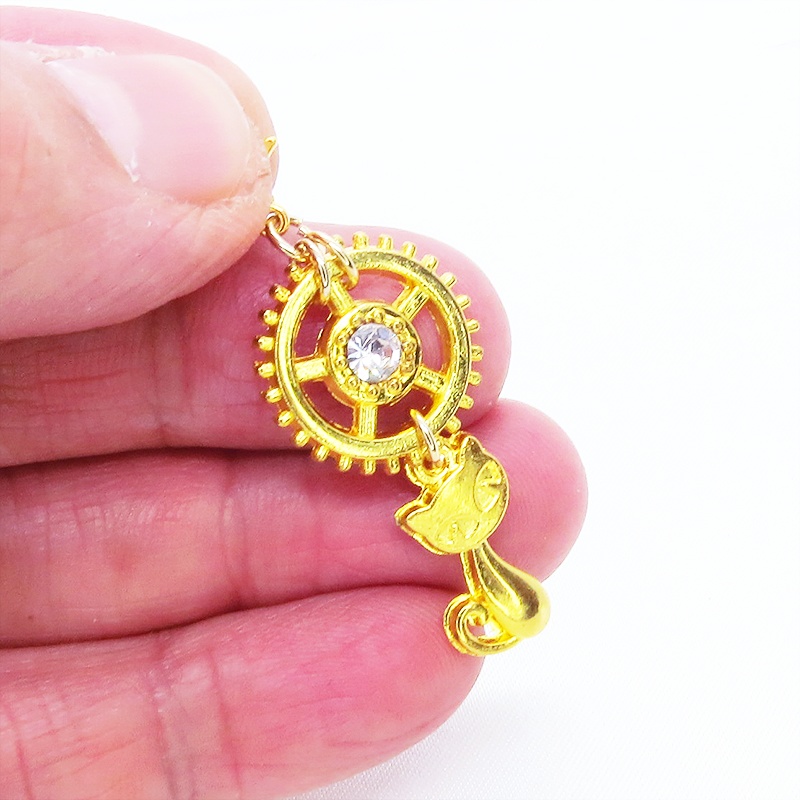 マスクチャーム 猫と大きめ歯車のチャーム ゴールドカラー スワロフスキー(クリアカラー) キーホルダー ペンダント