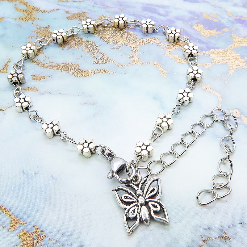 シルバカラーの花柄チェーンに蝶のモチーフをつけたブレスレット アジャスター付 バタフライブレスレット