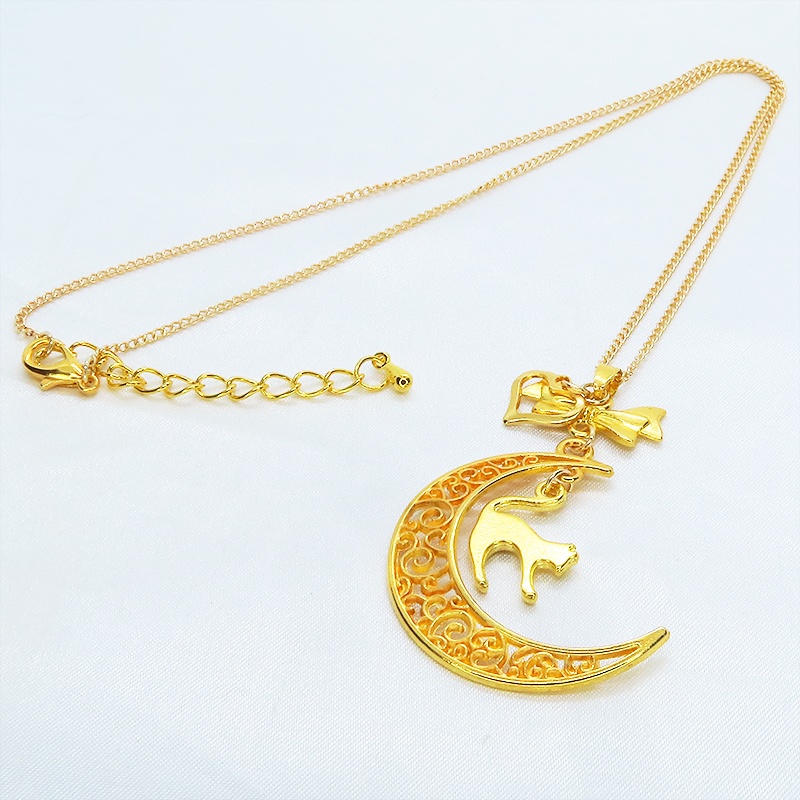 ゴールドカラーの跳ね猫と透かし三日月の大人可愛いネックレス ムーンネックレス リボン ハート