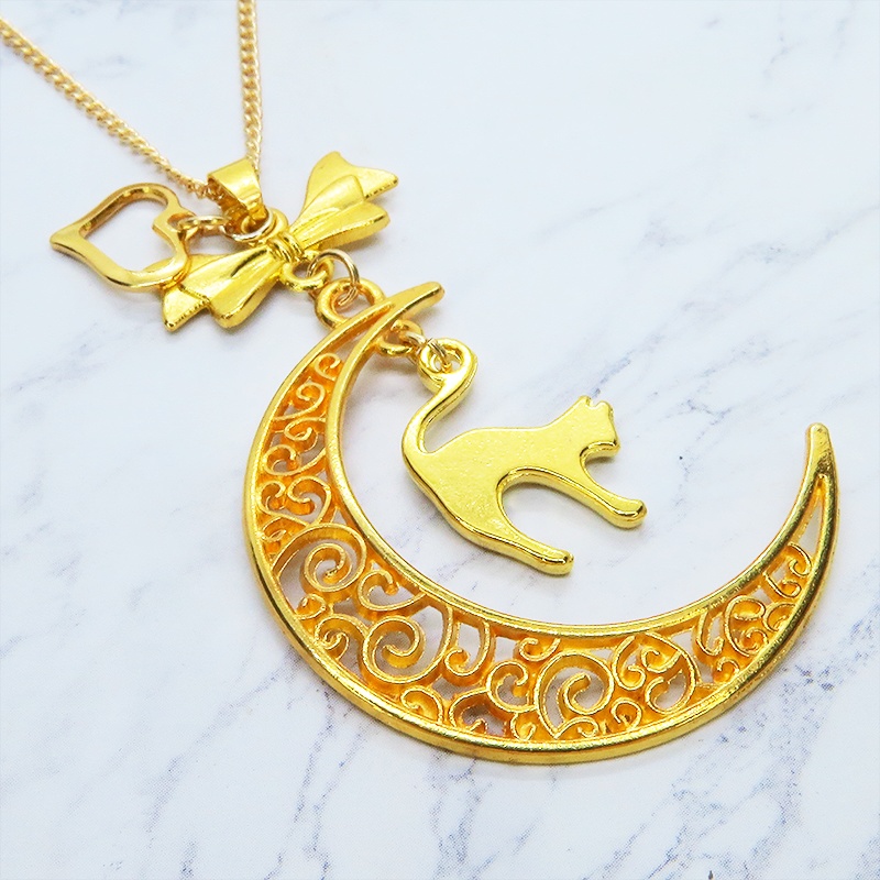 ゴールドカラーの跳ね猫と透かし三日月の大人可愛いネックレス ムーンネックレス リボン ハート