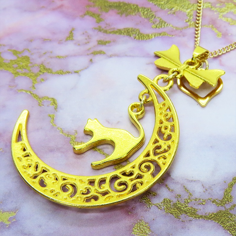 ゴールドカラーの跳ね猫と透かし三日月の大人可愛いネックレス ムーンネックレス リボン ハート