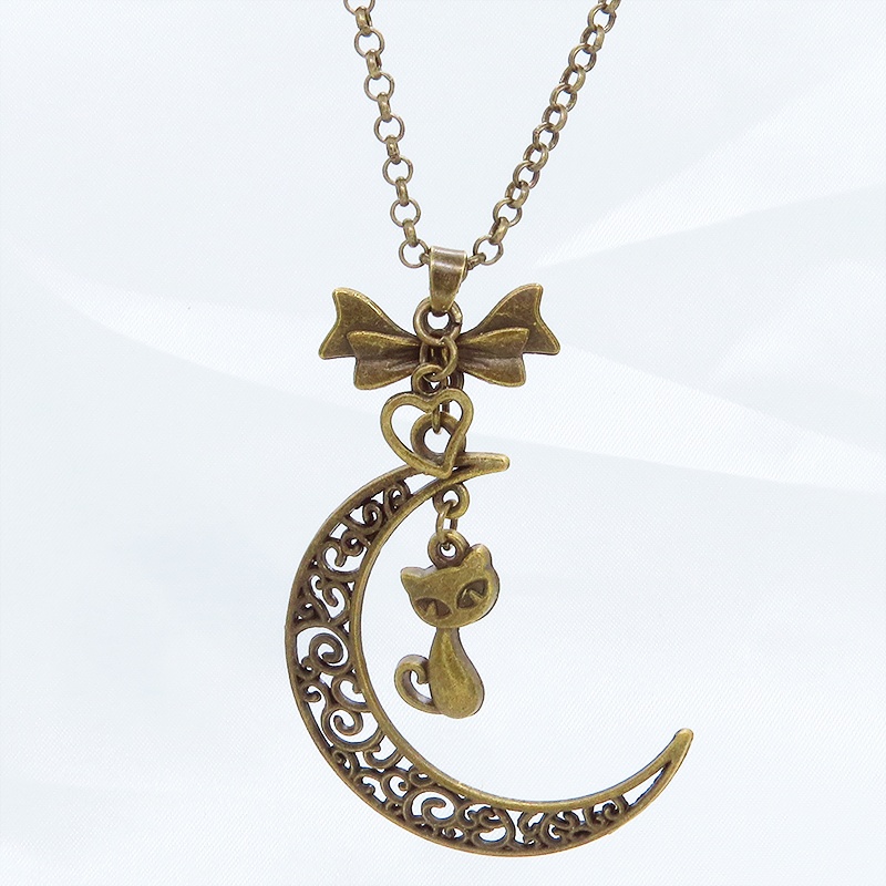 アンティークカラーの猫と透かし三日月の大人可愛いネックレス ムーンネックレス リボン ハート 金古美色