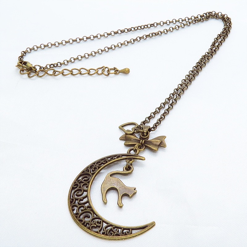 アンティークカラーの跳ね猫と透かし三日月の大人可愛いネックレス ムーンネックレス リボン ハート 金古美色