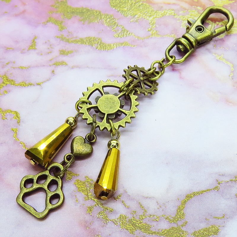 スチームパンク風アンティークカラーの歯車と肉球のメタルタッセルキーホルダー 猫 犬 バッグチャーム