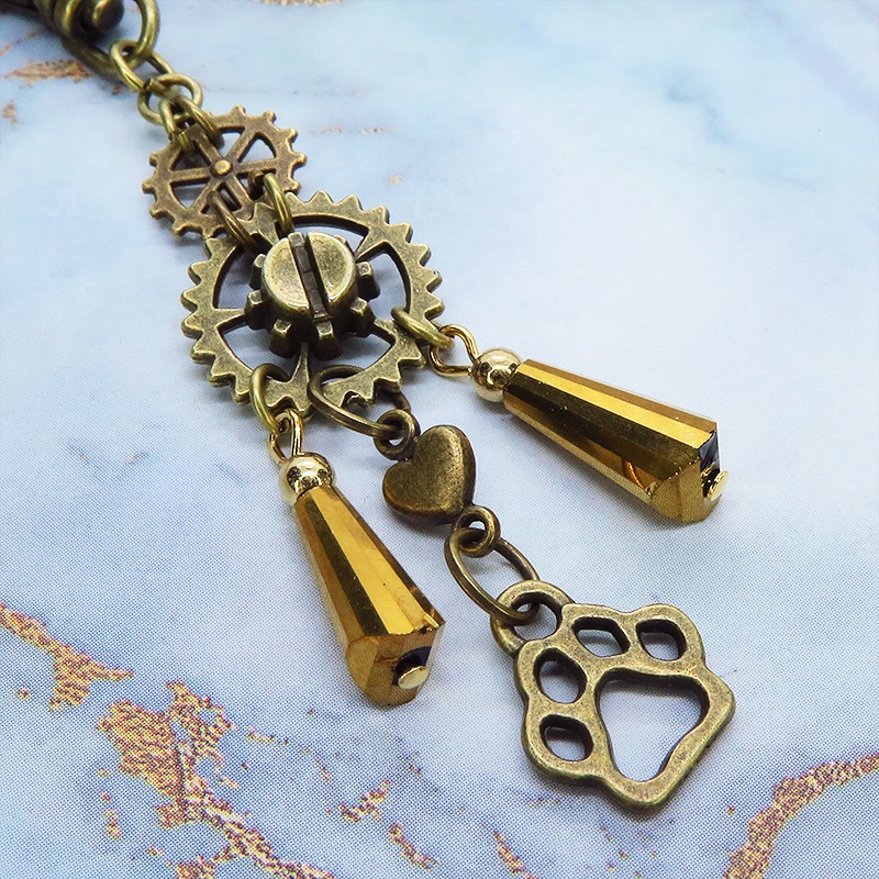 スチームパンク風アンティークカラーの歯車と肉球のメタルタッセルキーホルダー 猫 犬 バッグチャーム