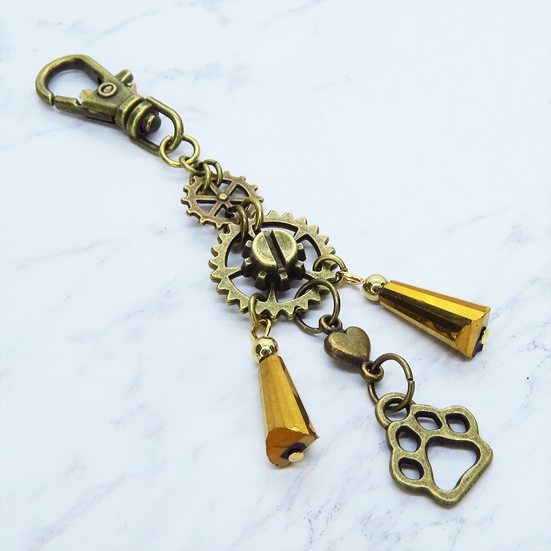 スチームパンク風アンティークカラーの歯車と肉球のメタルタッセルキーホルダー 猫 犬 バッグチャーム