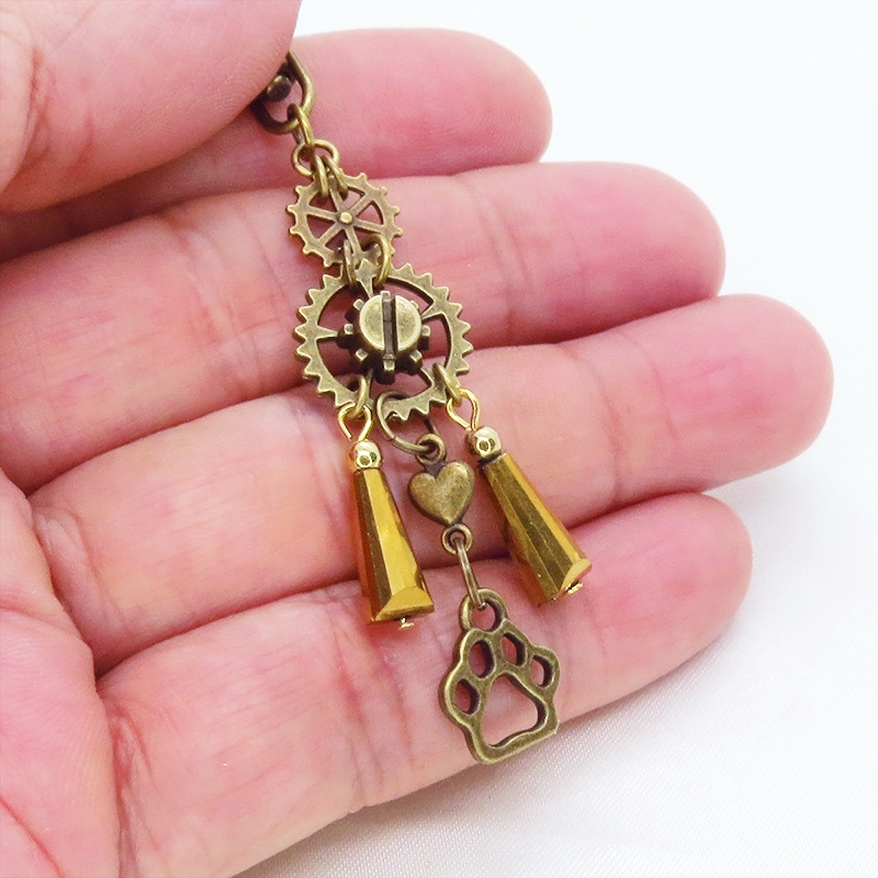 スチームパンク風アンティークカラーの歯車と肉球のメタルタッセルキーホルダー 猫 犬 バッグチャーム