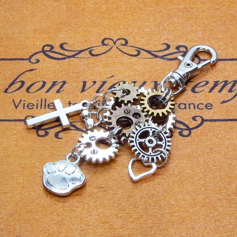 スチームパンク風 アンティークシルバーの肉球と歯車とロザリオのキーホルダー 猫好き 犬好き アシンメトリー