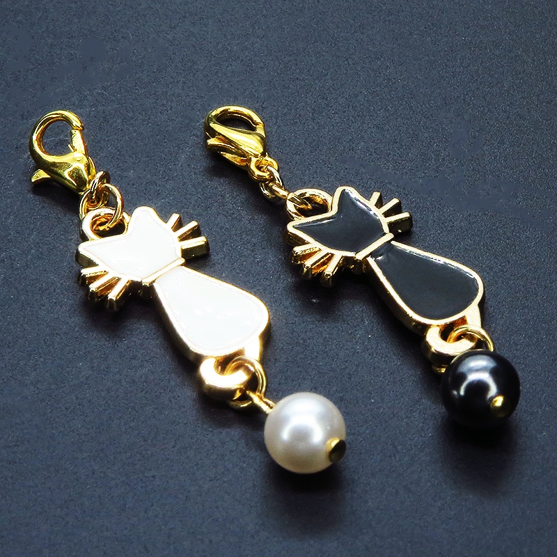 マスクチャーム 白猫 黒猫 エナメルモチーフとスワロフスキーパールをつなげたチャーム キーホルダー