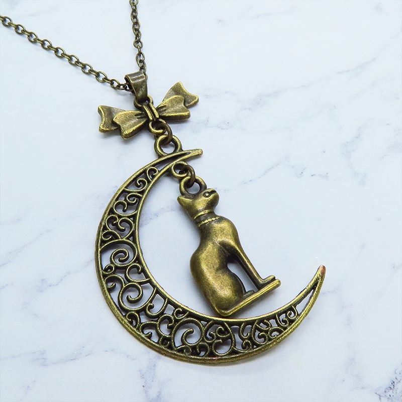 猫の神様 アンティークゴールドのバステト神と透かし三日月の大人可愛いネックレス ムーン リボン アジャスター付