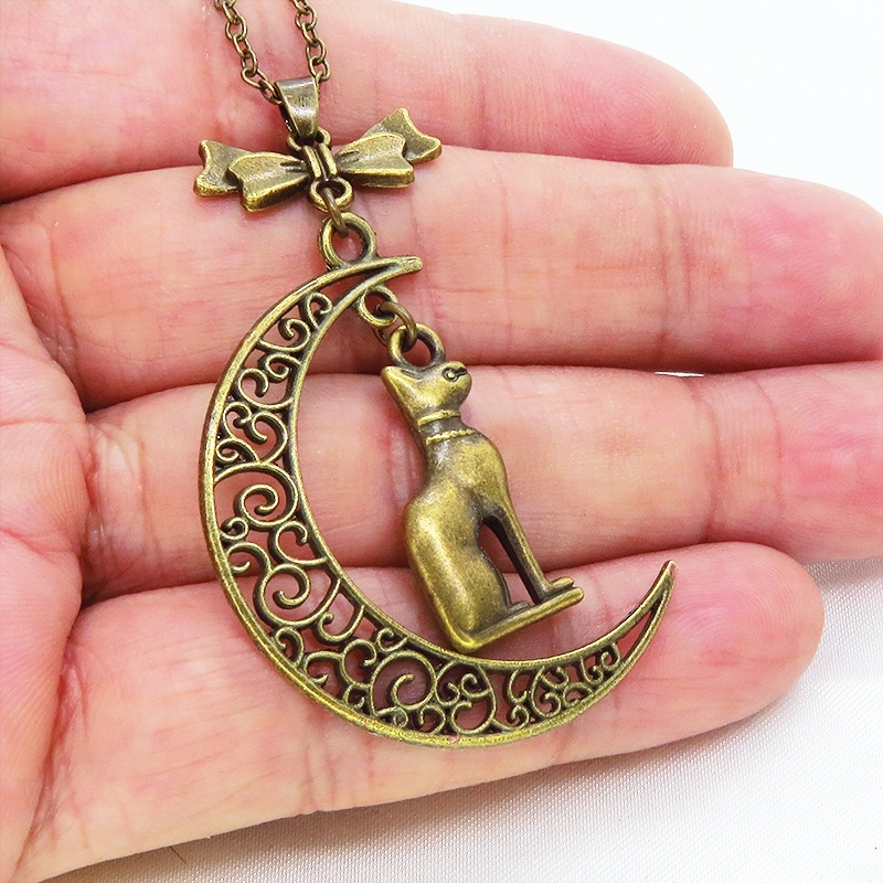 猫の神様 アンティークゴールドのバステト神と透かし三日月の大人可愛いネックレス ムーン リボン アジャスター付