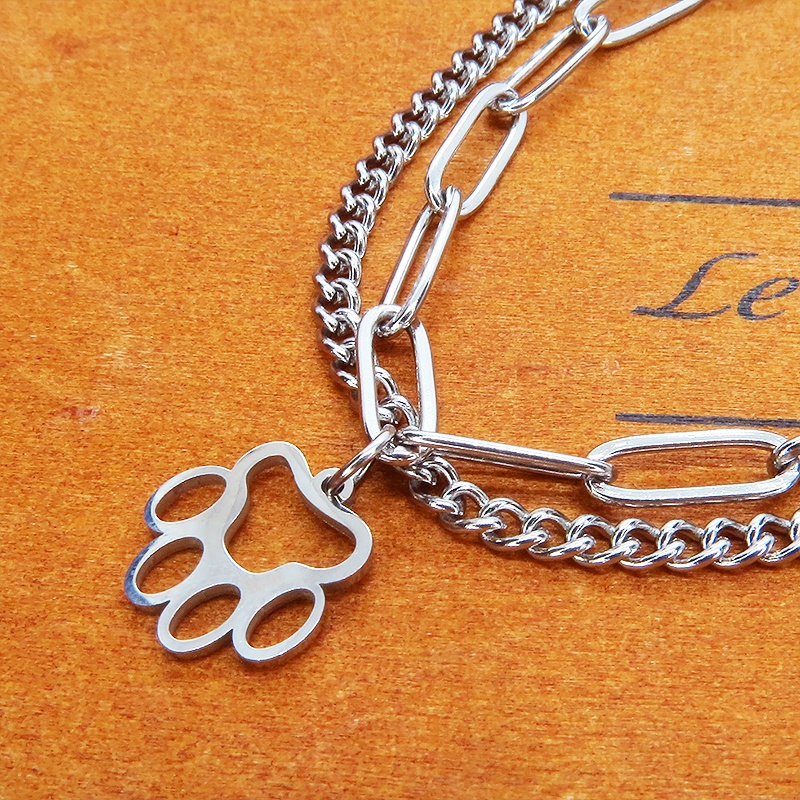 ステンレス製 シルバーカラー 肉球チャームのついたスリムなダブルチェーンブレスレット パンク ロック 猫 犬