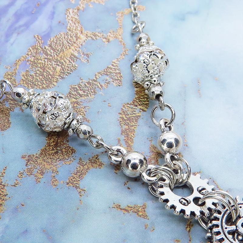 アンティークシルバー 翼と歯車を組合せたスチームパンク風ネックレス ロングチェーン 羽 フェザー ハート 時計の針