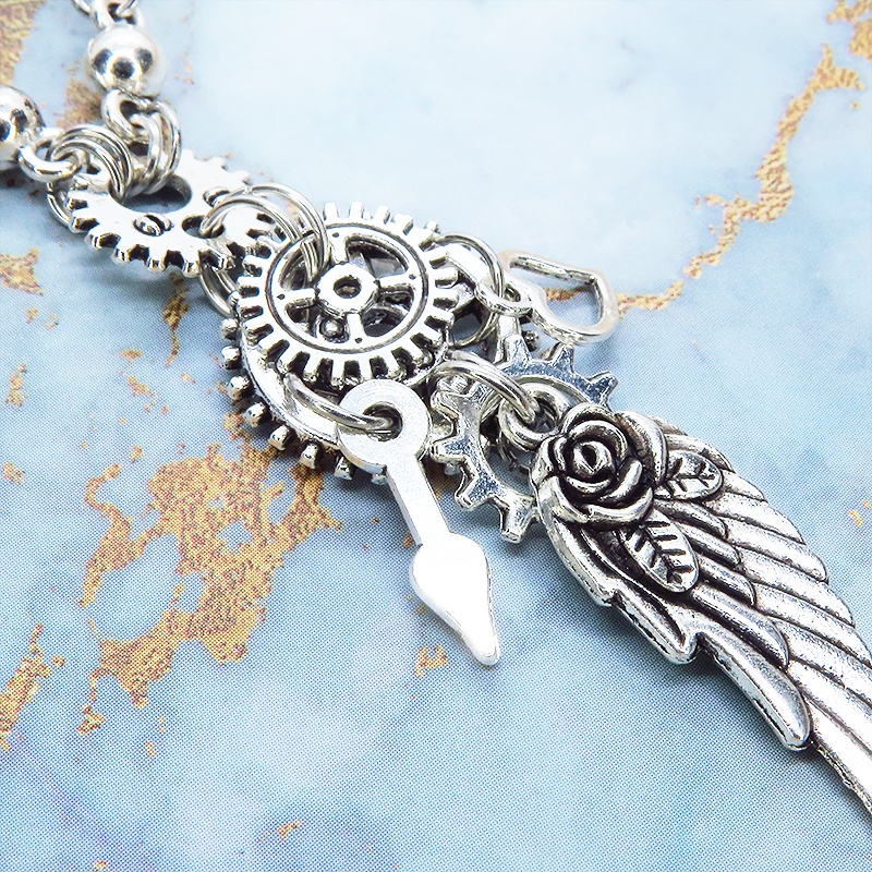 アンティークシルバー 翼と歯車を組合せたスチームパンク風ネックレス ロングチェーン 羽 フェザー ハート 時計の針