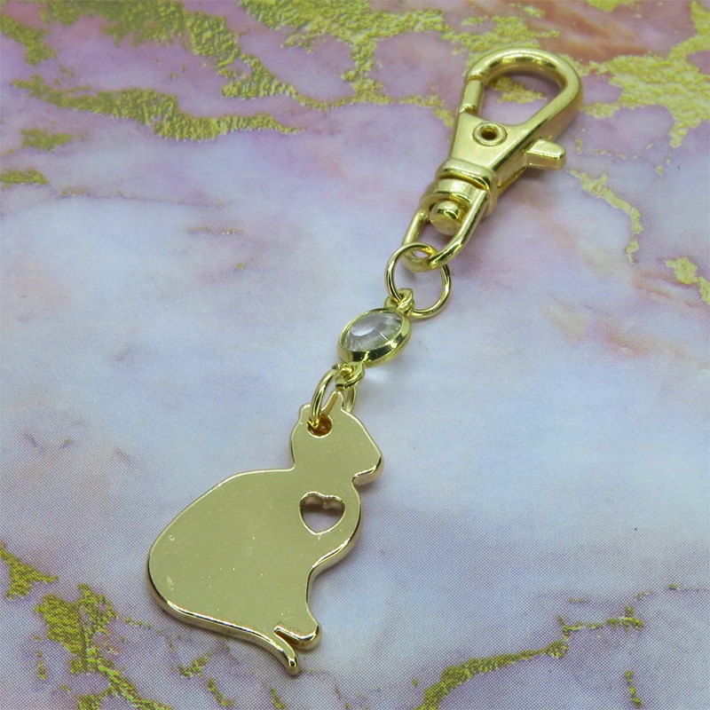 ゴールドカラー 猫シルエットモチーフとラインストーンのキーホルダー バッグチャーム シンプル クリア