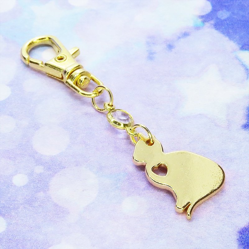 ゴールドカラー 猫シルエットモチーフとラインストーンのキーホルダー バッグチャーム シンプル クリア