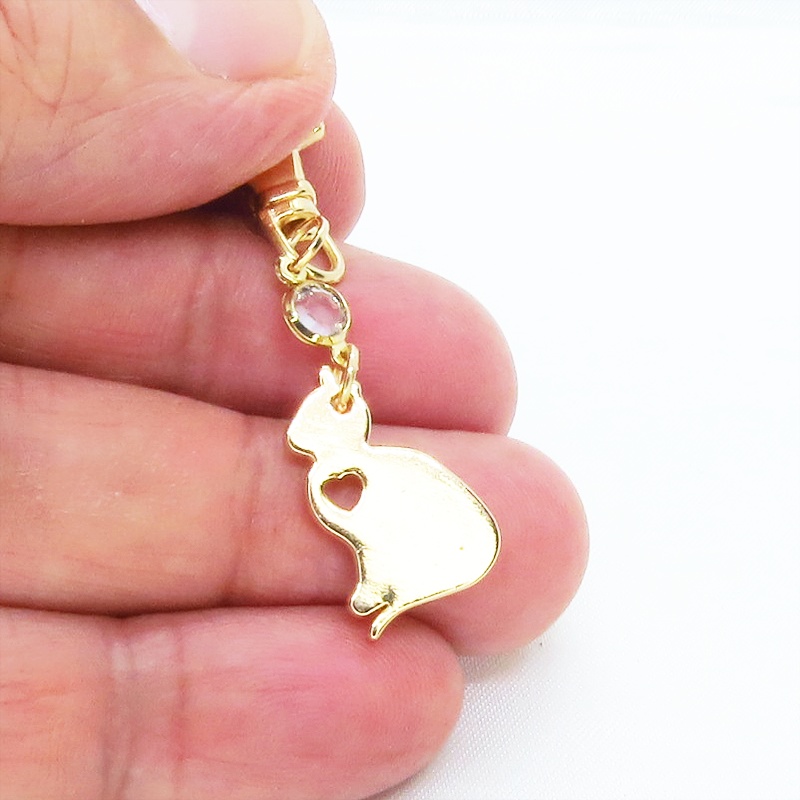 ゴールドカラー 猫シルエットモチーフとラインストーンのキーホルダー バッグチャーム シンプル クリア