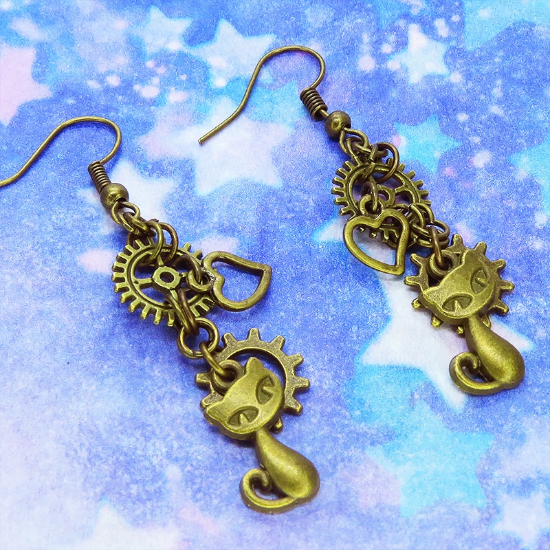 アンティークゴールド 猫と異なる歯車を組合せたスチームパンク風ピアス オープンハート