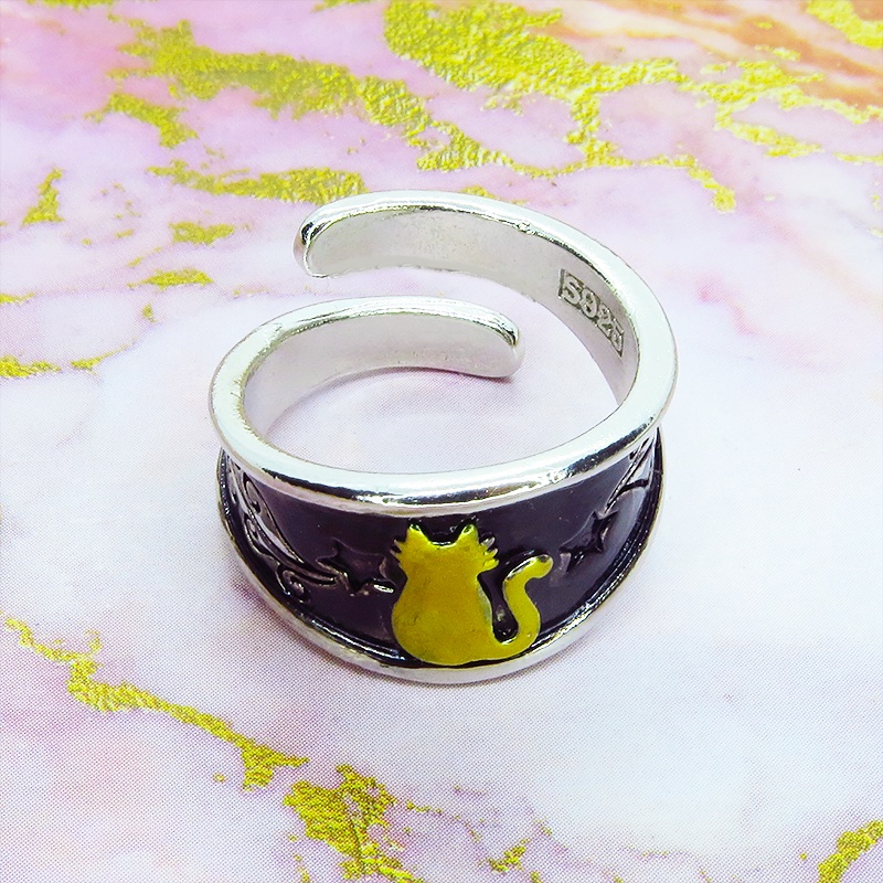 ゴールドの猫シルエットが描かれたブラックカラーリング シルバー925PL ステンレス フリーサイズ