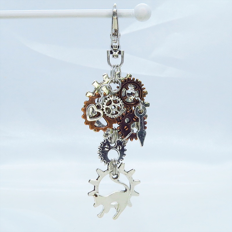 アンティークシルバー 跳ね猫と多重歯車のスチームパンク風キーホルダー バッグチャーム 多層 バイカラー アンティークブロンズ