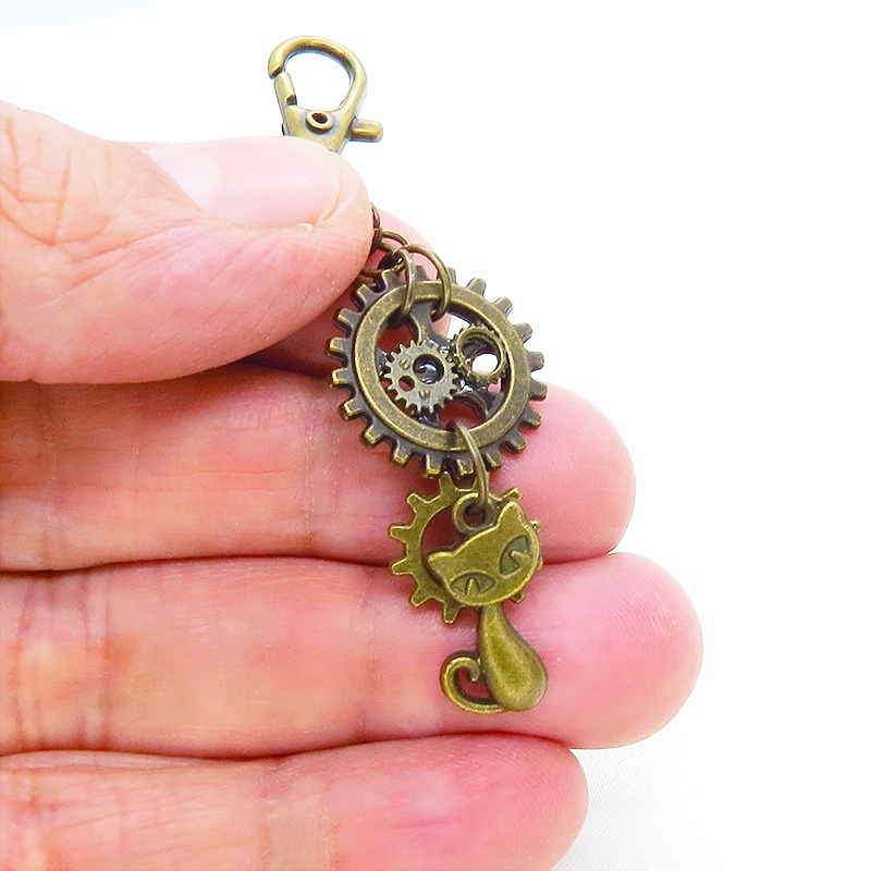 アンティークゴールド 猫と歯車を組合せたスチームパンク風キーホルダー バッグチャーム ファスナーチャーム