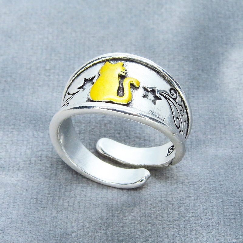 ゴールドの猫シルエットが描かれたシルバーカラーリング シルバー925PL ステンレス フリーサイズ