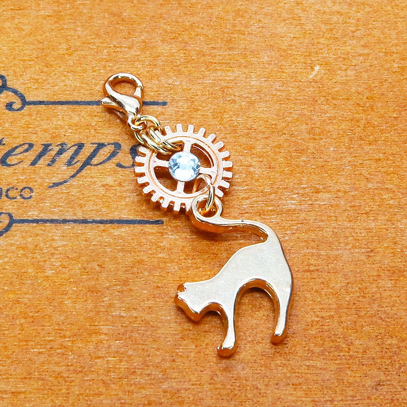 マスク・スマホチャーム マットゴールド 跳ね猫と歯車を組合せたチャーム ジャックピン追加可