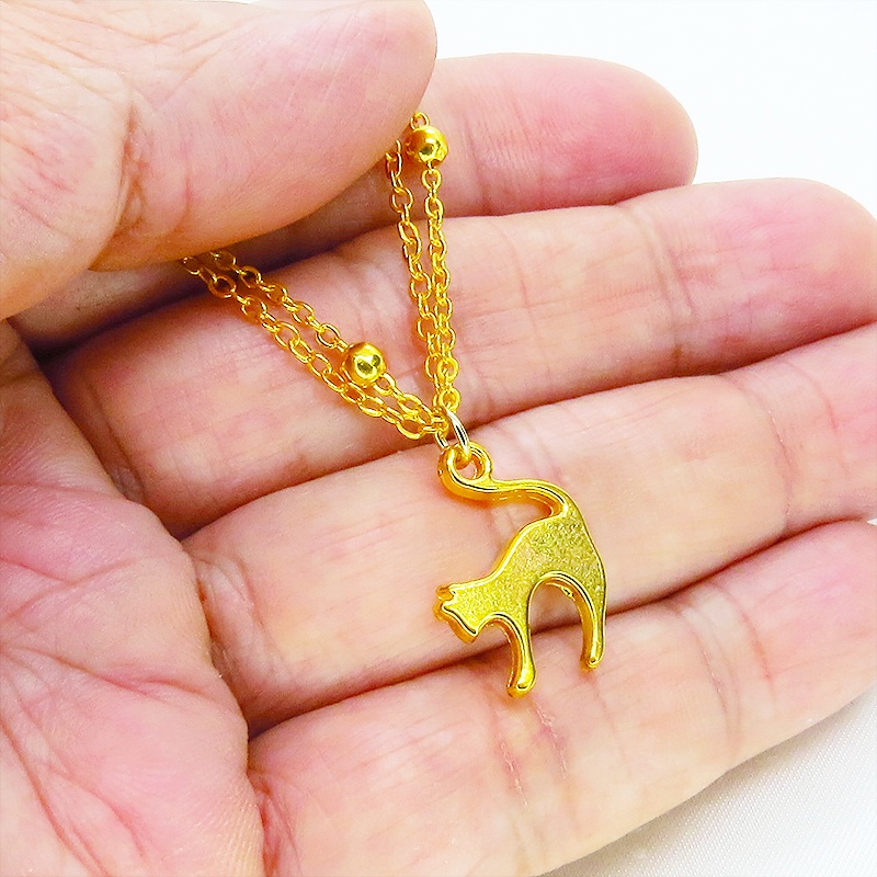 ゴールドカラー 跳ね猫モチーフのダブルチェーンブレスレット ビーズ付チェーン アジャスター可