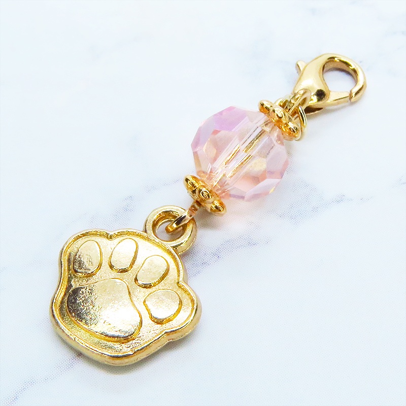 マスク・スマホチャーム マットゴールド 肉球モチーフとクリスタルガラスのチャーム 金具変更・ジャックピン追加可