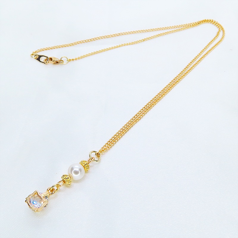 マットゴールド キュービックジルコニアの猫フェイスフレームとスワロフスキーパールのネックレス 長さ変更可 アジャスター可