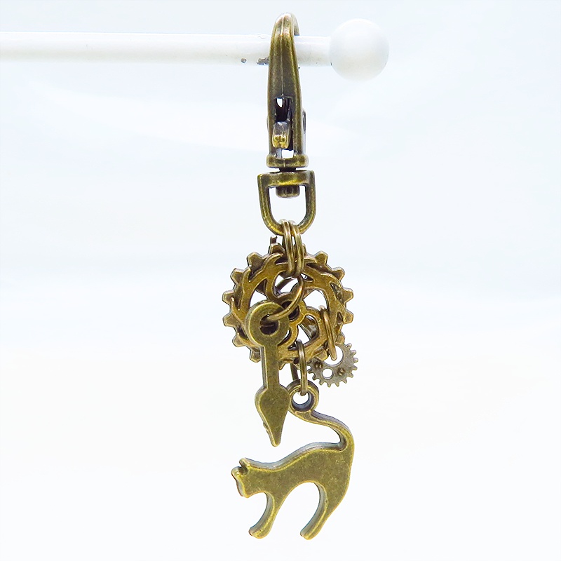 アンティークゴールド 跳ね猫と歯車を組み合わたコンパクトなスチームパンク風キーホルダー バッグチャーム
