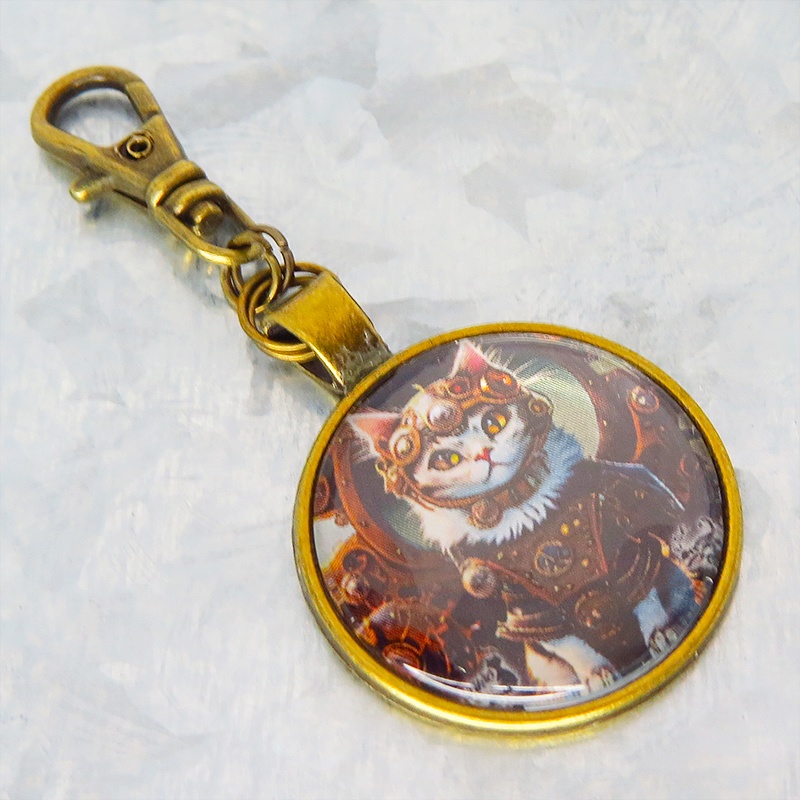 猫とスチームパンクなカボションガラスキーホルダー 零型アンティークゴールド仕様 金具変更可 バッグチャーム