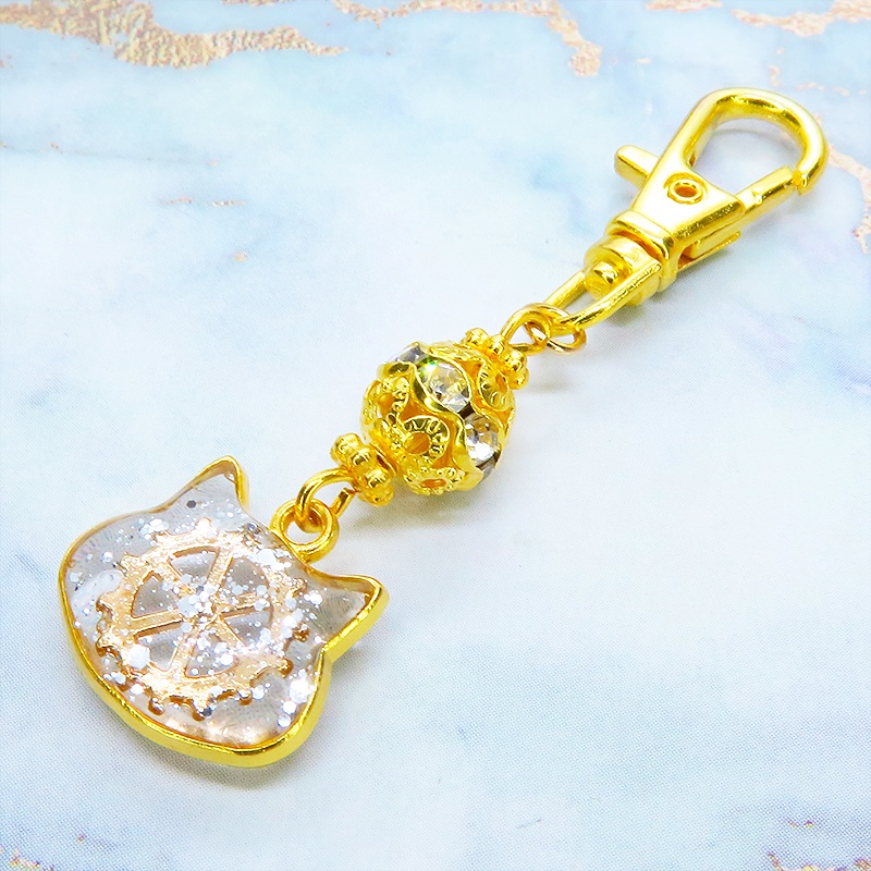 ゴールドカラー 猫フェイスに歯車を封入した可愛いキーホルダー レジン スチームパンク風 金具変更可